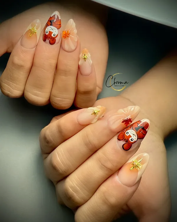Red and orange autumn leaf accent nails with gold