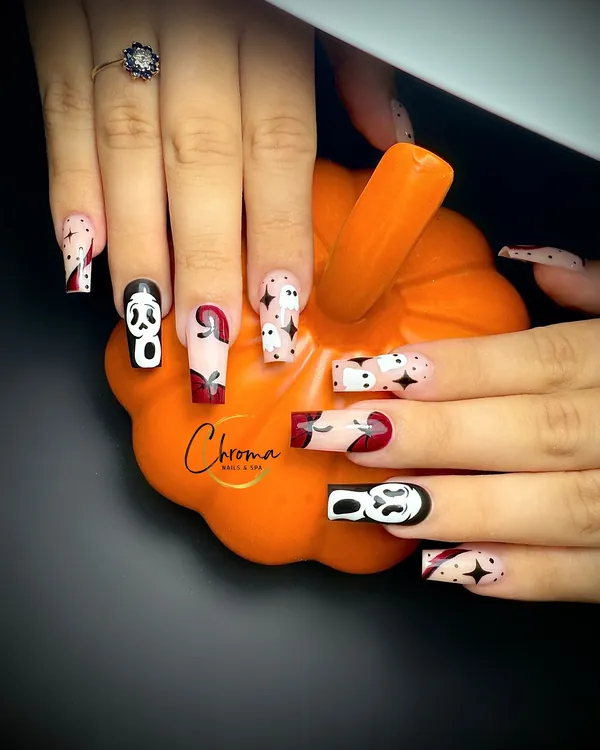 Long square nude nails with Ghostface masks, blood-red tips and black stars