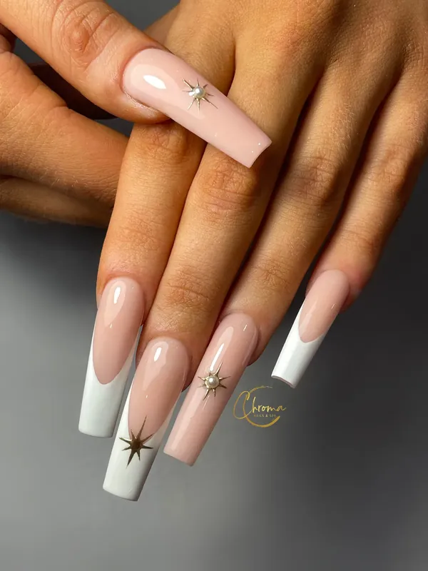 Long white French tips with gold star accents